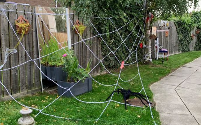 A life-sized spiders web, big enough to trap any human, stretching across a patch of grass at Hutton Avenue. 